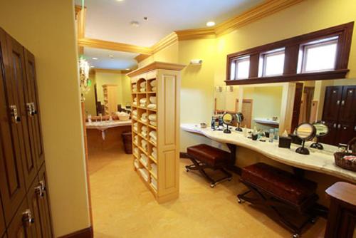 a bathroom with two sinks and a large mirror at Madonna Inn in San Luis Obispo