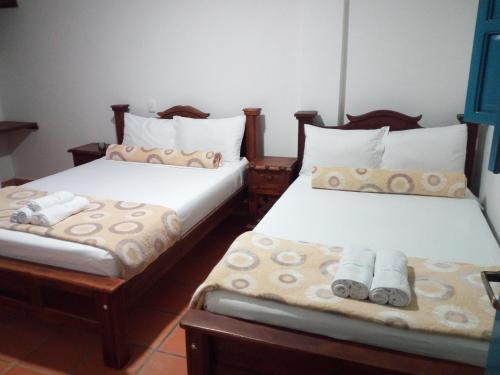 Ένα ή περισσότερα κρεβάτια σε δωμάτιο στο Hotel Casa Oasis