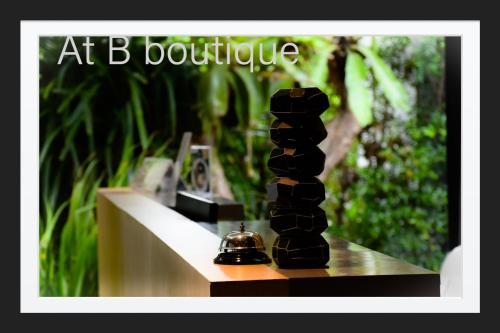 a black sculpture sitting on a counter in a room at B Boutique Residence in Suratthani