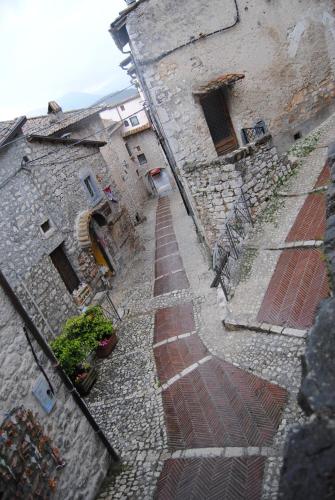 an overhead view of a stone building with a brick sidewalk at Locanda Il Falco Nero in Fumone