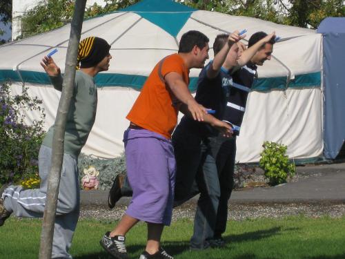 a group of men playing a game of frisbee at Sea of Galilee - Genghis Khan in The Golan in Giv'at Yo'av
