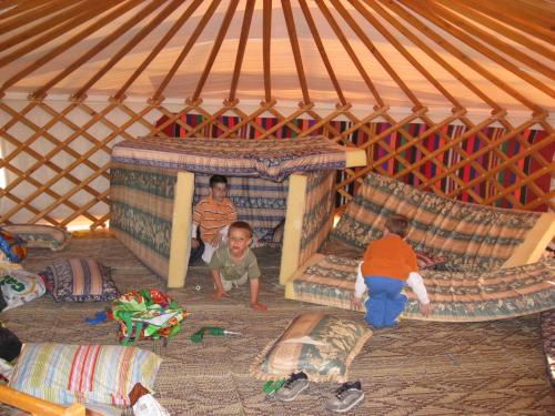 a group of children playing in a yurt at Sea of Galilee - Genghis Khan in The Golan in Giv'at Yo'av