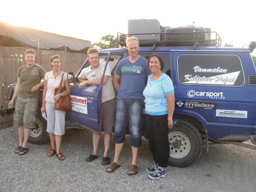 a group of people standing next to a blue truck at Sea of Galilee - Genghis Khan in The Golan in Giv'at Yo'av