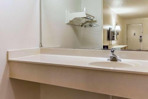 a bathroom with a sink and a mirror at Motel 6-Raleigh, NC - Cary in Cary