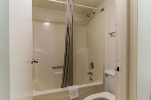 a bathroom with a shower and a toilet at Motel 6-Raleigh, NC - Cary in Cary