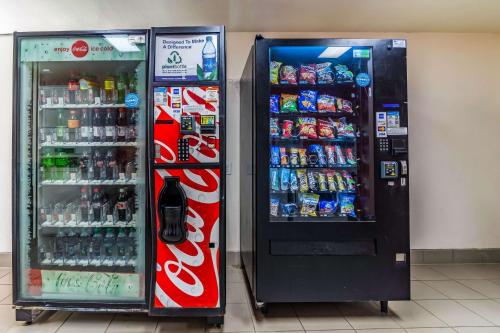 two soda machines are next to each other at Motel 6-Raleigh, NC - Cary in Cary
