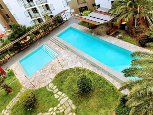 an overhead view of two swimming pools in a yard at Staying Places - The Avenue in Canberra