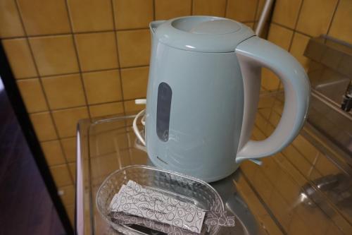 Příslušenství pro přípravu čaje a kávy v ubytování CUBIC.30