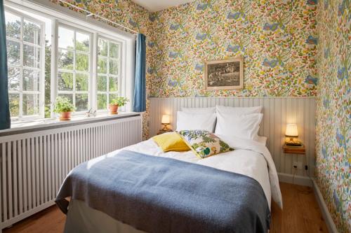 Tempat tidur dalam kamar di Hotel Hornbækhus