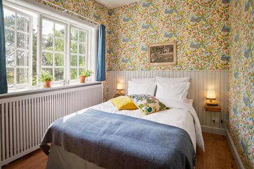 Postel nebo postele na pokoji v ubytování Hotel Hornbækhus