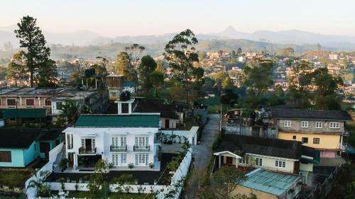 a view of a city with a white house at Hotel Mount Castle in Hatton