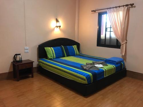 Кровать или кровати в номере Pim Bungalow