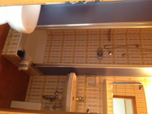 a view of a room with a ceiling with a mirror at Garni Sayonara in Selva di Val Gardena