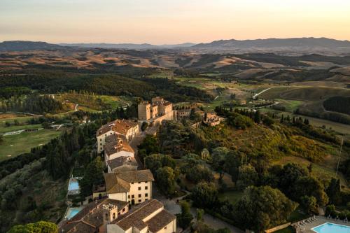 an aerial view of a castle in the hills at Castelfalfi in Castelfalfi