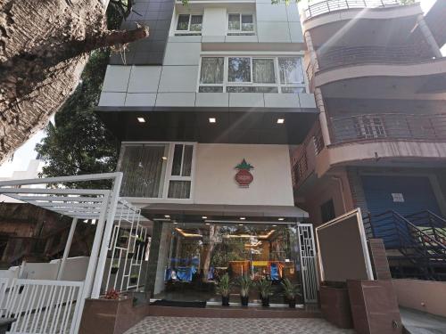 a building with a store in front of it at Treebo Trend Akshaya Bull Temple in Bangalore