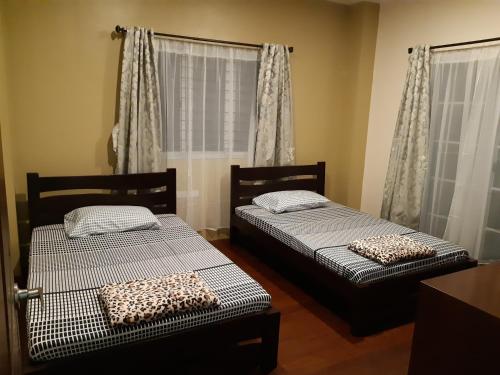 A bed or beds in a room at Restful 3BR Hillside Duplex House