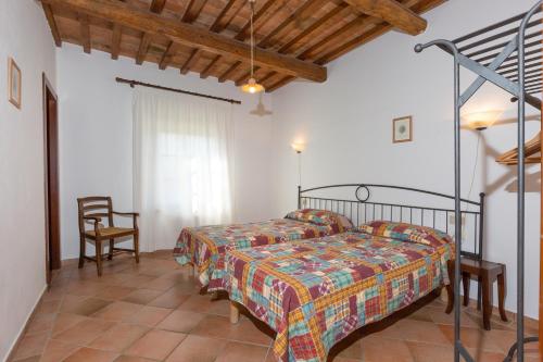 Postel nebo postele na pokoji v ubytování Relais La Pieve Vecchia