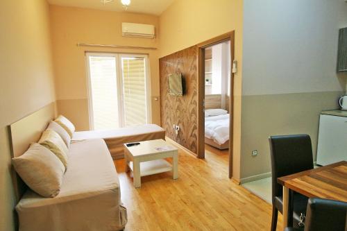 a living room with a couch and a table at Luxury Skopje Apartments Premium in Skopje