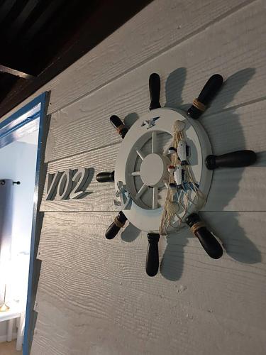a clock on the side of a wall at Phi Phi Indigo Hotel in Phi Phi Don