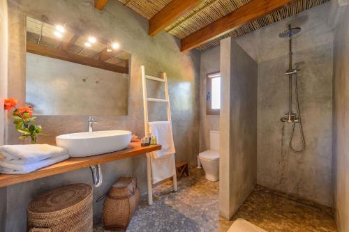 a bathroom with a sink and a shower and a toilet at New! Villa Can Colomaret Carmen in Santa Eularia des Riu
