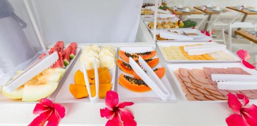 a buffet of different types of food on a table at Villa Amado in Morro de São Paulo