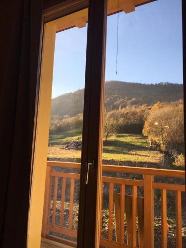 a view from a door looking out at the countryside at Agriturismo La Soglia Del Parco in Ranica