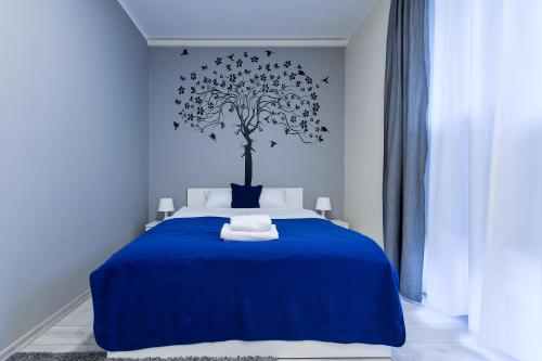 Posteľ alebo postele v izbe v ubytovaní MOKO Apartment II