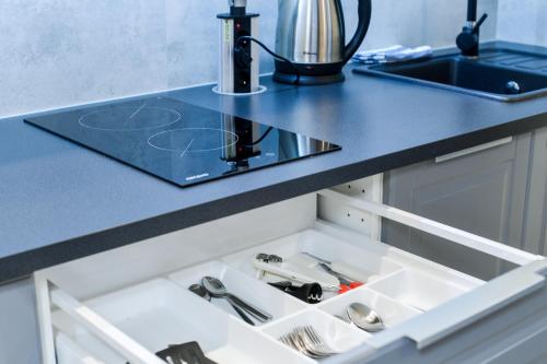 Kuchyňa alebo kuchynka v ubytovaní MOKO Apartment II