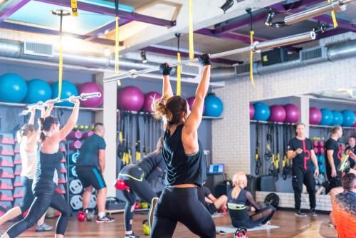 a group of people exercising in a gym at Pałac Bielawa in Bielawa