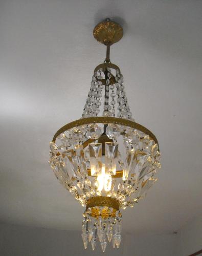 a chandelier hanging from a ceiling at Chambres d'Hôtes des Grands Prés in Argentan