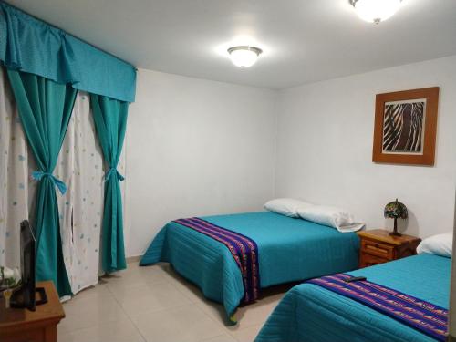 Ένα ή περισσότερα κρεβάτια σε δωμάτιο στο Casa Culhuac
