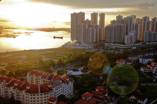 an aerial view of a city at sunset at Paragon Residences Straits View Homestay by WELCOME HOME in Johor Bahru