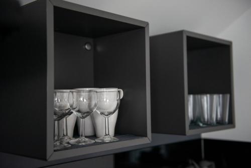 a shelf with three wine glasses on it at Paula&Matej Airport Zagreb in Selnica Šćitarjevska