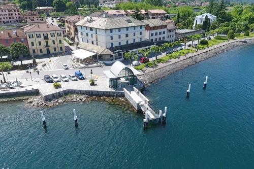 an aerial view of a dock in a body of water at Hotel Risi in Colico