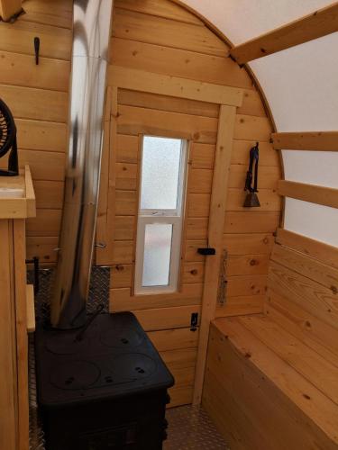 an inside view of a log cabin with a stove at K3 Guest Ranch in Cody