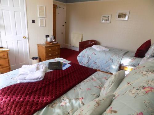 Ένα ή περισσότερα κρεβάτια σε δωμάτιο στο Glendale Guest House