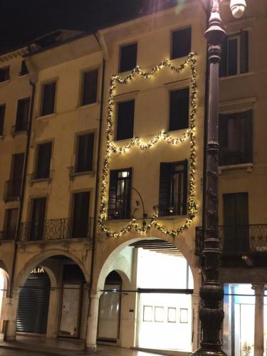 a building with christmas lights on the side of it at Palazzina300 in Treviso