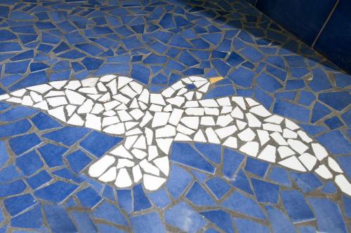 a white bird stenciled on a blue floor at Hotel Il Gabbiano in Positano