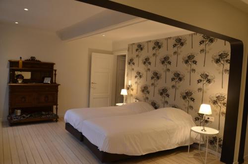 Un pat sau paturi într-o cameră la La Maurianne