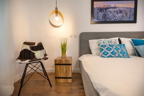 En eller flere senge i et værelse på Venice Boutique Aparthotel