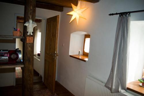 a hallway with a star on the wall at Apartmány v Chalupe in Stará Lesná