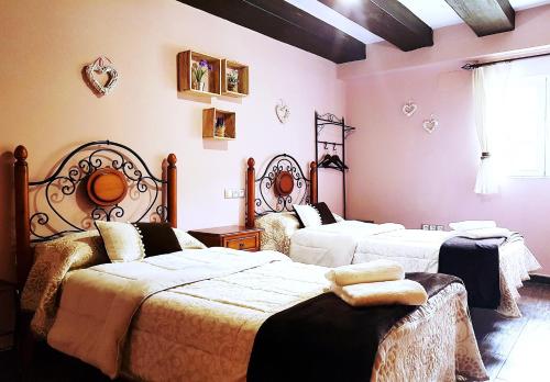 Ένα ή περισσότερα κρεβάτια σε δωμάτιο στο Apartamento Rural San Jorge Bajo