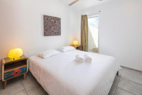 Ένα ή περισσότερα κρεβάτια σε δωμάτιο στο Casa Tuia Resort