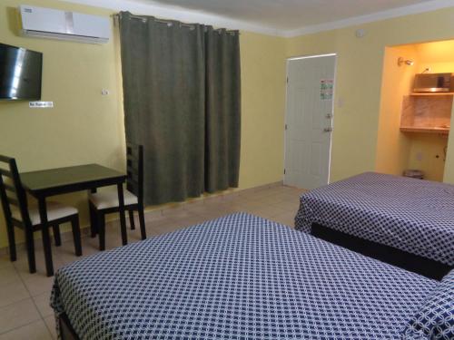 Ένα ή περισσότερα κρεβάτια σε δωμάτιο στο Hotel Panama 510