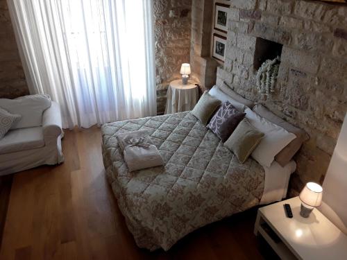 Postel nebo postele na pokoji v ubytování Suite Assisi