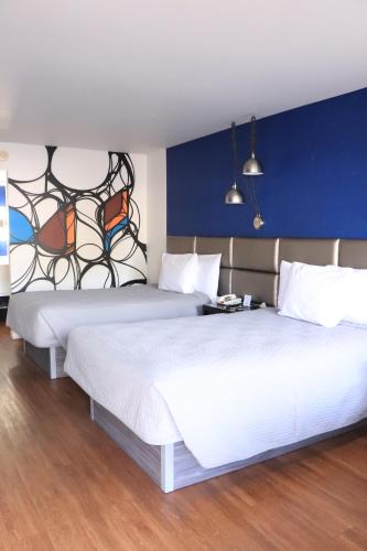 Postel nebo postele na pokoji v ubytování University Inn