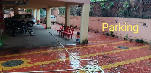 a hose is on the floor of a building at The Salvation Army RED SHIELD GUEST HOUSE in Kolkata