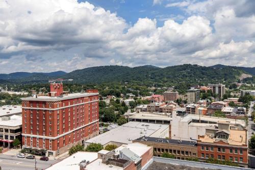 an aerial view of a city with mountains in the background at Cambria Hotel Downtown Asheville in Asheville