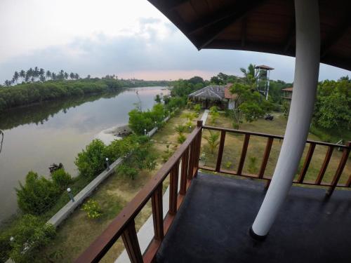 a view of a river from a balcony at Pearl Cave Cabanas & Resturant in Tangalle