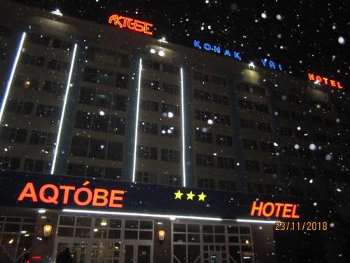 a hotel with two stars on the front of it at Aktobe Hotel in Aktobe